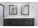 Bathroom features a double sink vanity, dual mirrors, and great lighting at 4851 W Gandy Blvd # B1L8, Tampa, FL 33611