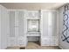 Bedroom features built-in cabinets and a vanity at 4851 W Gandy Blvd # B1L8, Tampa, FL 33611