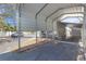 View of the carport and the front of this home with a painted foundation and a covered entry at 4851 W Gandy Blvd # B1L8, Tampa, FL 33611