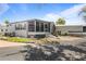 Charming home featuring a screened-in porch and carport, perfect for outdoor enjoyment at 4851 W Gandy Blvd # B1L8, Tampa, FL 33611