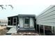 Charming home with a cozy screened-in porch and carport, perfect for enjoying the outdoors at 4851 W Gandy Blvd # B1L8, Tampa, FL 33611