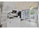 Bright kitchen features white cabinets, marble countertops, and stainless steel appliances at 4851 W Gandy Blvd # B1L8, Tampa, FL 33611