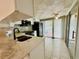 Modern kitchen with white cabinets, updated appliances, and lots of natural light at 4851 W Gandy Blvd # B1L8, Tampa, FL 33611