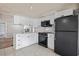 Well-equipped kitchen featuring modern appliances and crisp white cabinetry at 4851 W Gandy Blvd # B1L8, Tampa, FL 33611