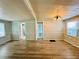 Spacious living room featuring modern flooring and natural light through the window at 4851 W Gandy Blvd # B1L8, Tampa, FL 33611