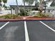 View of a parking lot with two signs indicating 