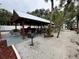 Picture of the picnic area with a grill, tables, and a covered area for residents to gather at 4851 W Gandy Blvd # B1L8, Tampa, FL 33611