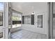 Cozy screened-in porch with tile flooring and ample natural light at 4851 W Gandy Blvd # B1L8, Tampa, FL 33611