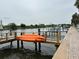 Waterfront home with private dock and orange kayak, providing easy access to the water at 4851 W Gandy Blvd # B1L8, Tampa, FL 33611