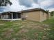 Backyard featuring a screen porch and the side of the house at 505 Innergary Pl, Valrico, FL 33594