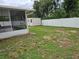 Backyard featuring a screen porch, fenced yard, and storage shed at 505 Innergary Pl, Valrico, FL 33594