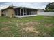 Screen porch, fenced yard and exterior home view at 505 Innergary Pl, Valrico, FL 33594