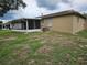 Backyard featuring a screen porch and the side of the house at 505 Innergary Pl, Valrico, FL 33594