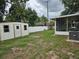 Backyard view featuring shed, screen porch and vinyl fencing at 505 Innergary Pl, Valrico, FL 33594