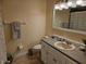 Bathroom showcasing tile flooring, a vanity with decorative countertop, and toilet at 505 Innergary Pl, Valrico, FL 33594