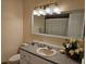 Bathroom featuring a vanity with decorative countertop, sink, and large mirror at 505 Innergary Pl, Valrico, FL 33594