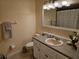 Well-maintained bathroom features an oval sink, decorative lighting, and patterned shower curtain at 505 Innergary Pl, Valrico, FL 33594
