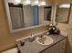 Comfortable bathroom with a large vanity, decorative mirror, and attractive vanity lighting at 505 Innergary Pl, Valrico, FL 33594