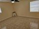 Cozy bedroom with a ceiling fan and neutral-toned walls and tile at 505 Innergary Pl, Valrico, FL 33594