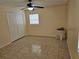 Bedroom with a closet, tile flooring and a bright window at 505 Innergary Pl, Valrico, FL 33594