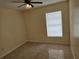 Bedroom with ceiling fan, window and tile flooring at 505 Innergary Pl, Valrico, FL 33594