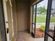 Inviting screened entrance with a view of the landscaped yard and neighborhood at 505 Innergary Pl, Valrico, FL 33594