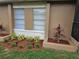 Exterior view of a home with nice windows, landscaping, and planter boxes at 505 Innergary Pl, Valrico, FL 33594