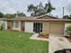Charming single-story home featuring a well-manicured front yard and attached garage at 505 Innergary Pl, Valrico, FL 33594