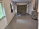Spacious garage with white walls, a sealed concrete floor, and a window for natural light at 505 Innergary Pl, Valrico, FL 33594