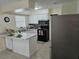 Well-lit kitchen with stainless steel appliances and center island at 505 Innergary Pl, Valrico, FL 33594