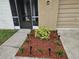 Landscaping view with wood mulch, plants and solar lighting at 505 Innergary Pl, Valrico, FL 33594