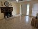Spacious living room with tile floors, fireplace, and natural light at 505 Innergary Pl, Valrico, FL 33594