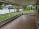 Screened-in patio area with tile flooring overlooking the backyard at 505 Innergary Pl, Valrico, FL 33594
