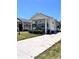 Inviting single-story home featuring a spacious front porch and a well-manicured lawn, perfect for relaxation at 5351 Leisure Ln, New Port Richey, FL 34652