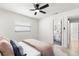 Serene bedroom with soft colors, a comfortable bed, and a view of the ensuite bathroom for convenience at 621 89Th N Ave, St Petersburg, FL 33702