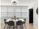 Inviting dining room featuring modern decor, natural light, and a spacious table for comfortable meals at 621 89Th N Ave, St Petersburg, FL 33702