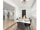 Bright dining room with modern table and chairs, open to kitchen with stainless steel appliances at 621 89Th N Ave, St Petersburg, FL 33702