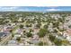 An aerial view showing a neighborhood streetscape with a mix of homes and mature trees lining the streets at 621 89Th N Ave, St Petersburg, FL 33702