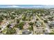 Scenic aerial view of the neighborhood with a mix of homes, mature trees, and nearby roads at 621 89Th N Ave, St Petersburg, FL 33702