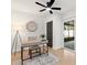Office featuring a modern desk, dark trim, and natural light at 621 89Th N Ave, St Petersburg, FL 33702