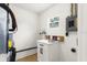Utility room with window and modern white cabinets at 621 89Th N Ave, St Petersburg, FL 33702