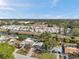 A captivating aerial perspective highlighting the home's setting within a lush, green community at 6738 Criswell N Ave, St Petersburg, FL 33709