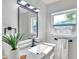 Stylish bathroom with a modern vanity, sleek fixtures, and elegant finishes, creating a spa-like retreat at 6738 Criswell N Ave, St Petersburg, FL 33709