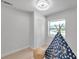 Bedroom features a playful teepee, closet, and a bright window, ideal for a space at 6738 Criswell N Ave, St Petersburg, FL 33709