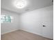 Clean, modern bedroom with sleek hardwood floors and ample natural light at 6738 Criswell N Ave, St Petersburg, FL 33709