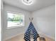 Bright ' bedroom with a large window and a fun teepee tent for playtime at 6738 Criswell N Ave, St Petersburg, FL 33709