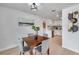 Stylish dining room adjacent to the kitchen with hardwood floors and modern decor at 6738 Criswell N Ave, St Petersburg, FL 33709