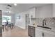 Well-lit dining room featuring a modern table set with hardwood floors at 6738 Criswell N Ave, St Petersburg, FL 33709