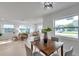 Bright living room with large windows, comfortable seating, and modern decor, perfect for relaxation and entertaining at 6738 Criswell N Ave, St Petersburg, FL 33709