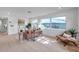 Bright living room with modern furniture, hardwood floors, and large windows at 6738 Criswell N Ave, St Petersburg, FL 33709